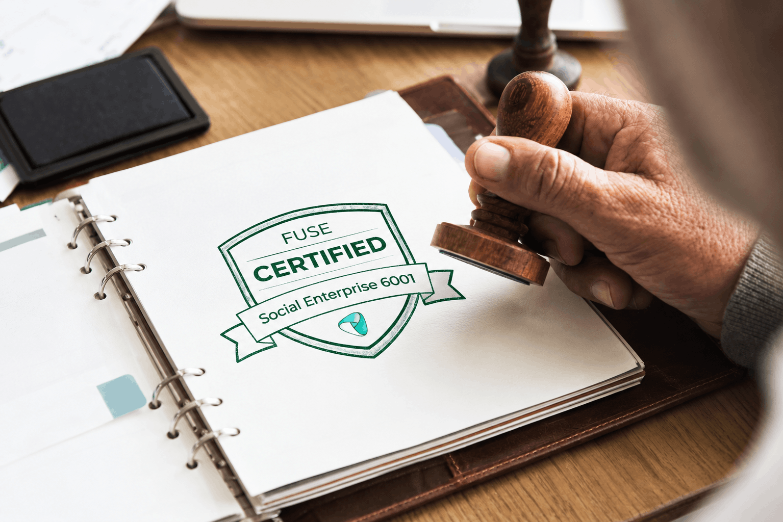 FUSE certification stamp being applied to a social enterprise record